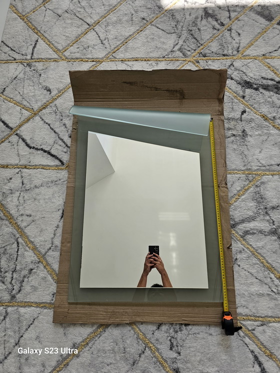 Image 1 of 80's mirror in perfect condition with curved design