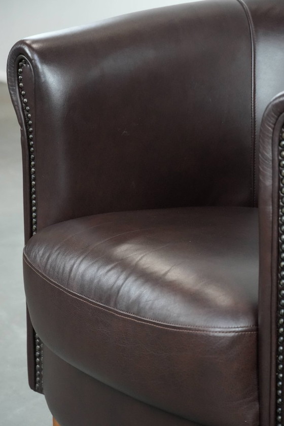Image 1 of Cowhide club armchair, in very good condition, English style in a brown/dark purple color scheme