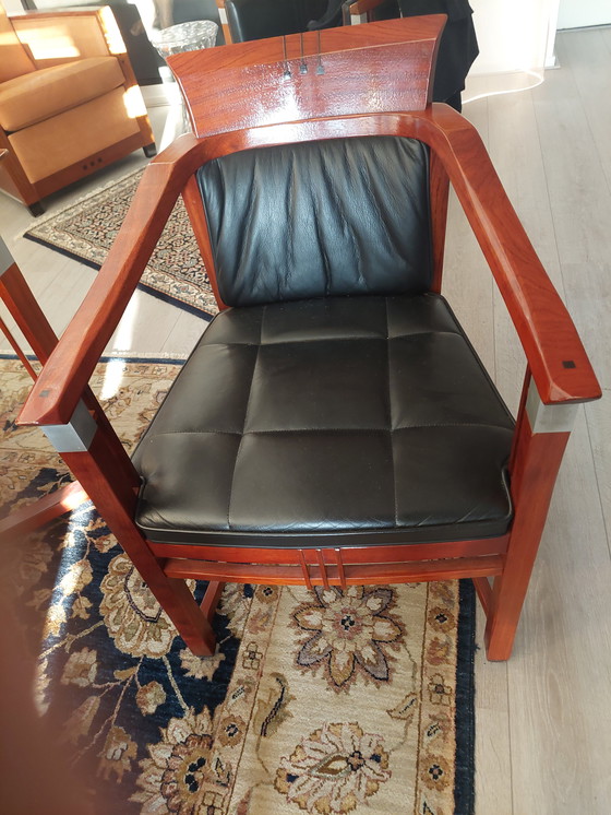 Image 1 of Rectangular long dining table with four luxurious leather-upholstered chairs by Schuitema Stadskanaal. In very good condition.