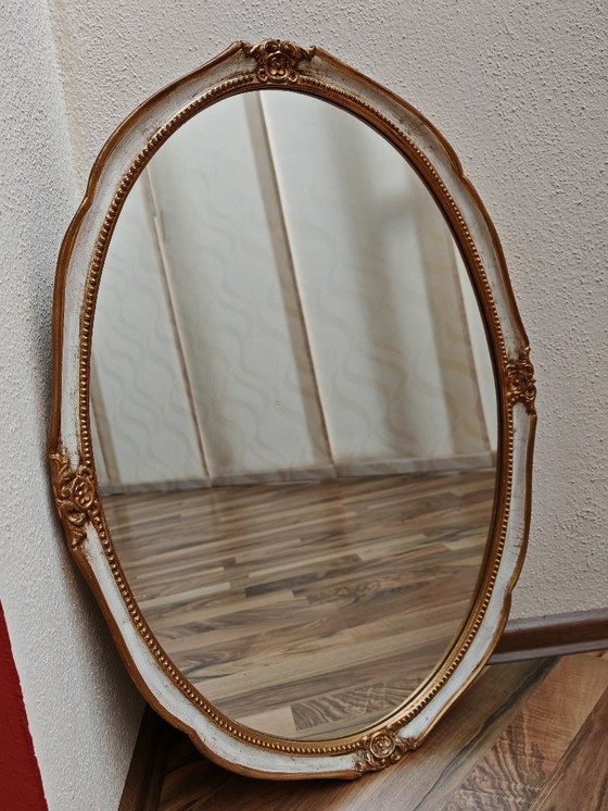 Image 1 of Oval mirror with wooden frame, white, gold from an estate