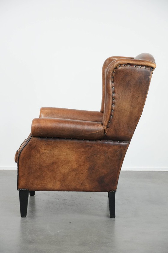 Image 1 of Sheepskin wing chair with a characterful appearance