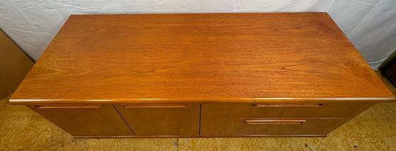 Image 1 of Mid-century retro vintage teak sideboard by Meredew 1960  This elegant teak sideboard by Meredew is a superb example of mid-cent