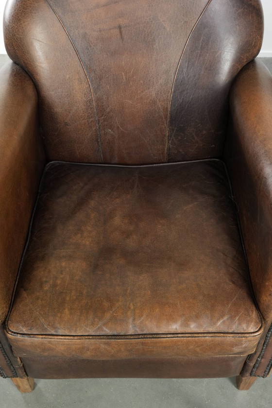 Image 1 of 2 fauteuils design en peau de mouton avec une belle patine