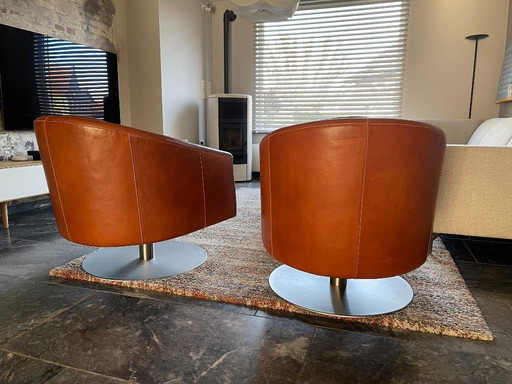 Two Natuzzi Swivel Armchairs in Leather