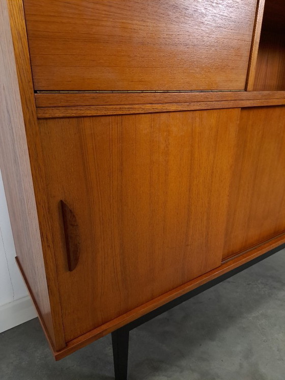 Image 1 of Armario de pared de teca con cajones, barra y patas negras