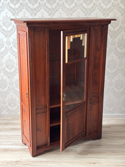 Bannink Hunters cabinet with stained glass display door and paneled side door - Craftsman Dutch furniture piece