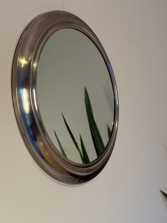 Image 1 of round mirror with metal frame, dating back to the 1970s