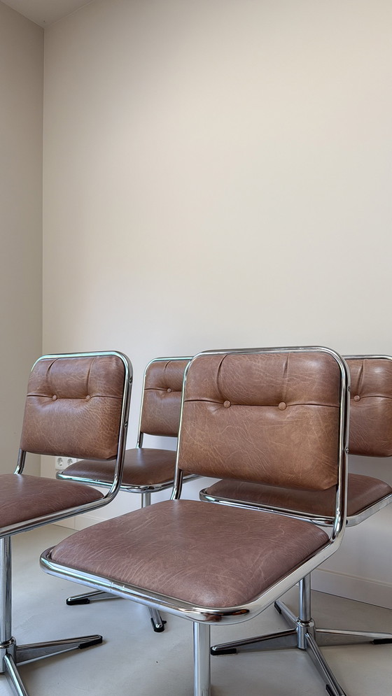 Image 1 of Four vintage chrome swivel chairs with faux leather