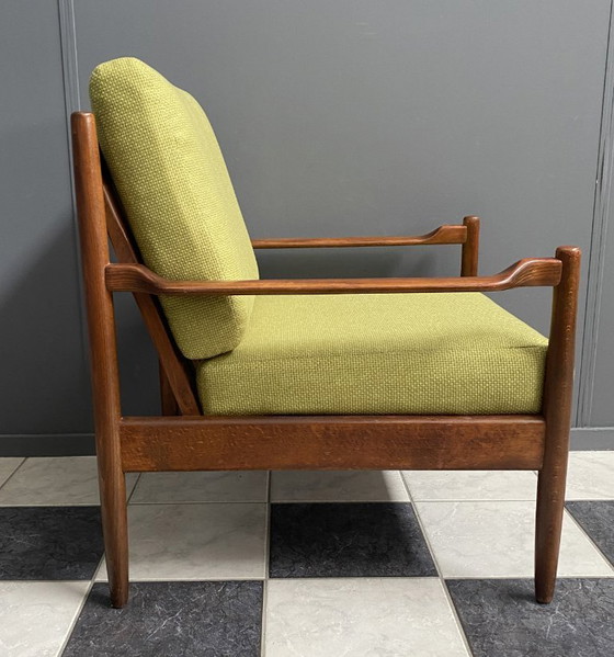 Image 1 of Gele stoffen en houten relaxstoel uit de jaren 60.