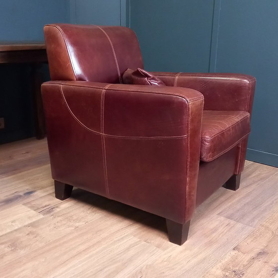 Image 1 of Timeless cowhide leather club armchair, atmospheric and inviting.