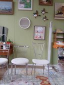 Four stainless steel chairs with boucle fabric