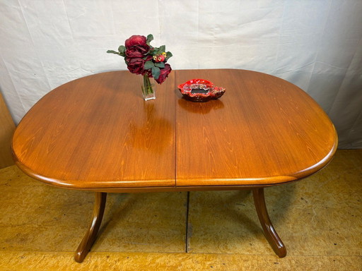 Mid Century Retro Teak Oval Danish Extending Dining Table (Circa 1960–1970)  A stunning mid century modern teak oval extending d