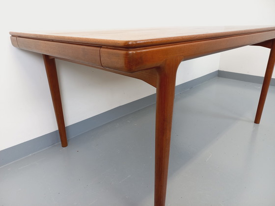 Image 1 of Scandinavian rectangular vintage dining table by Johannes Andersen for Samcom from the 60s in teak with integrated extensions