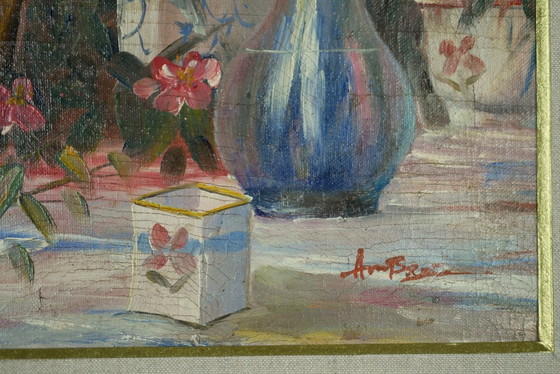 Image 1 of Still life with pink flowers and blue pots.