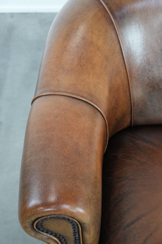 Image 1 of Vintage stoere 2-zits clubbank gemaakt van schapenleer