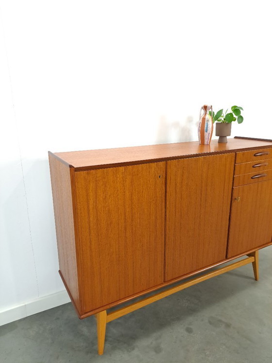 Image 1 of Armadio in teak con gambe inclinate e cassetti dalla Svezia