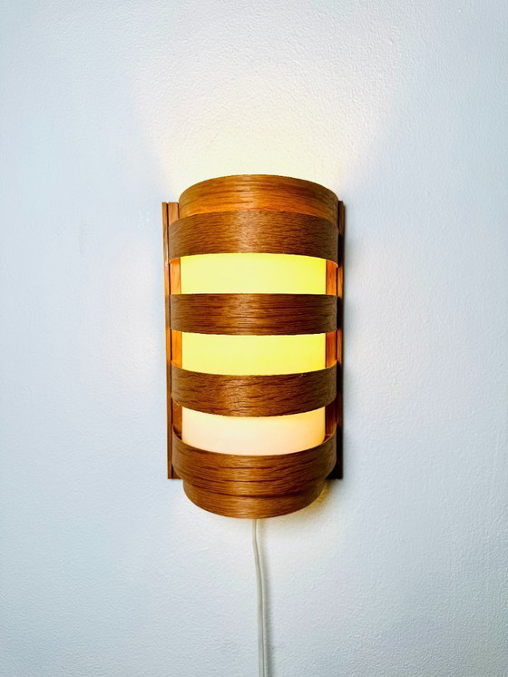 Image 1 of Elegant mid-century wall lamp crafted from curved pine veneer, produced in Sweden during the 1960s.