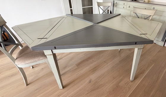 Image 1 of Handkerchief table with 4 leaves and 4 chairs