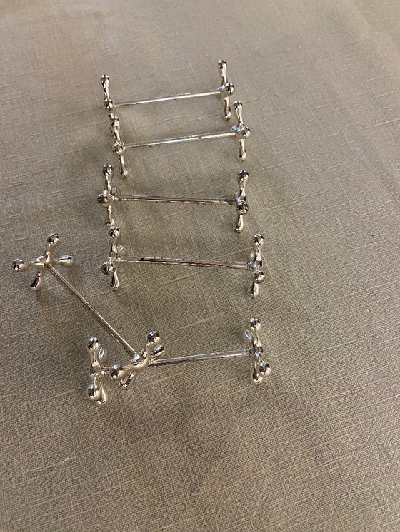 Image 1 of EN VENTA: 6 soportes / accesorios plateados para cuchillos