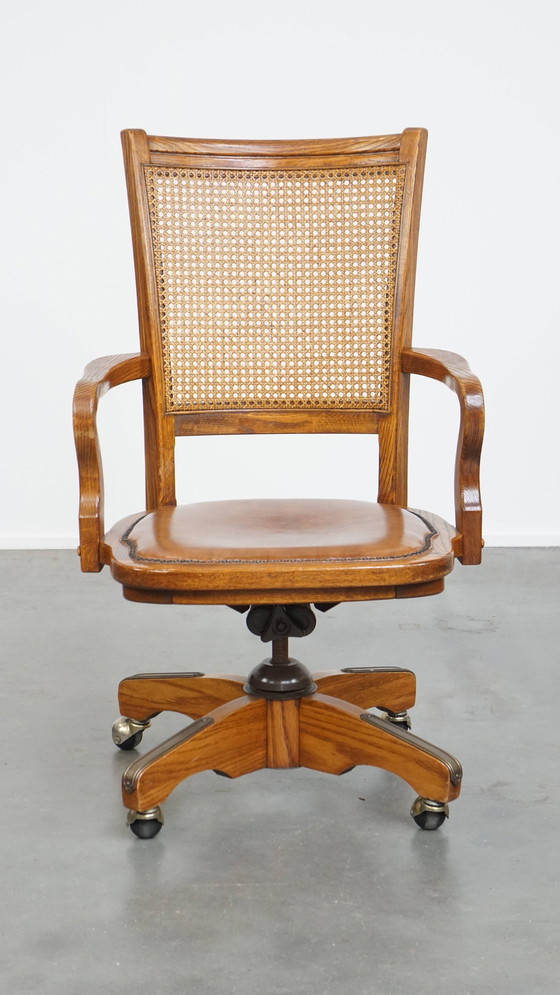 Image 1 of Cognac Colored Leather Office Chair on Wheels with Wood and a Wicker Matted Backrest