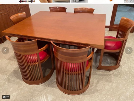 Frank Lloyd Wright Husser Dining Table with Six Barrel Chairs for Cassina in Cherry Wood and Red Leather