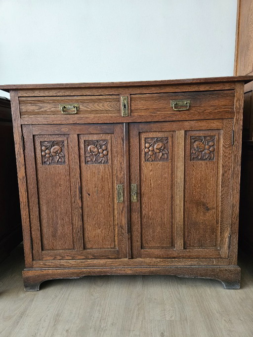 Antique cabinet with grape motif