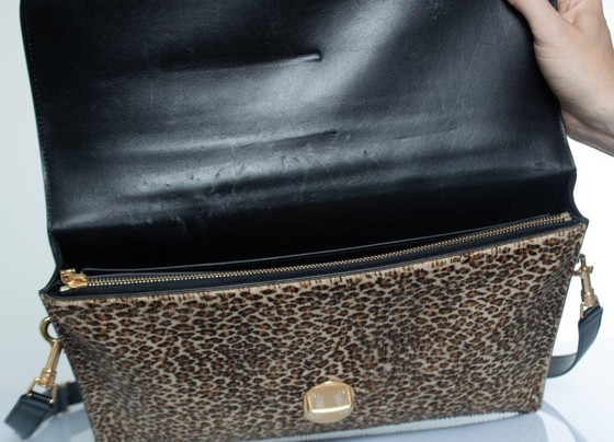Image 1 of Porte-documents Céline en cuir imprimé léopard noir et marron