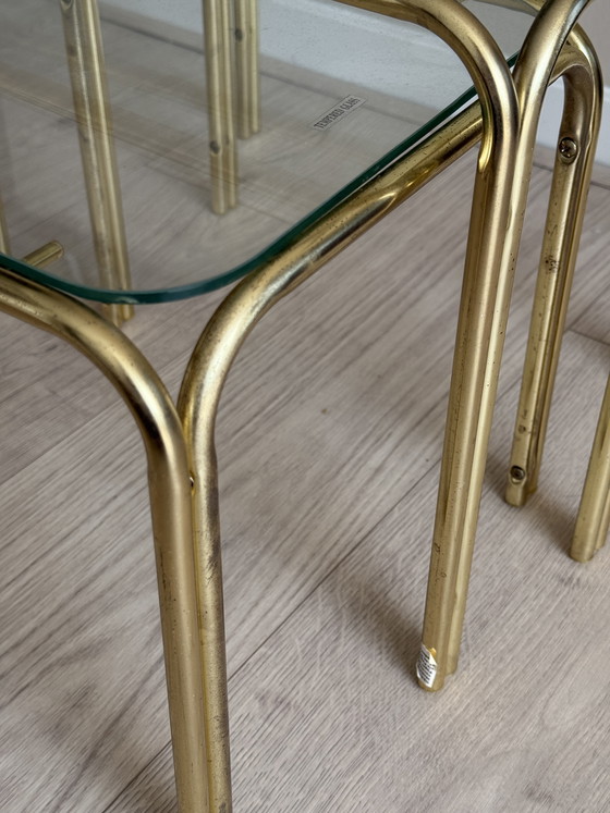 Image 1 of Set van 3 vintage gouden tafeltjes met glazen blad