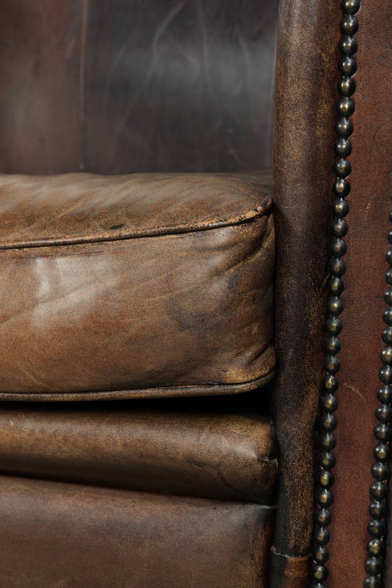 Image 1 of 2 fauteuils design en peau de mouton avec une belle patine