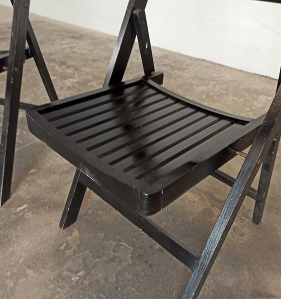 Image 1 of 2 vintage zwarte houten klapstoelen