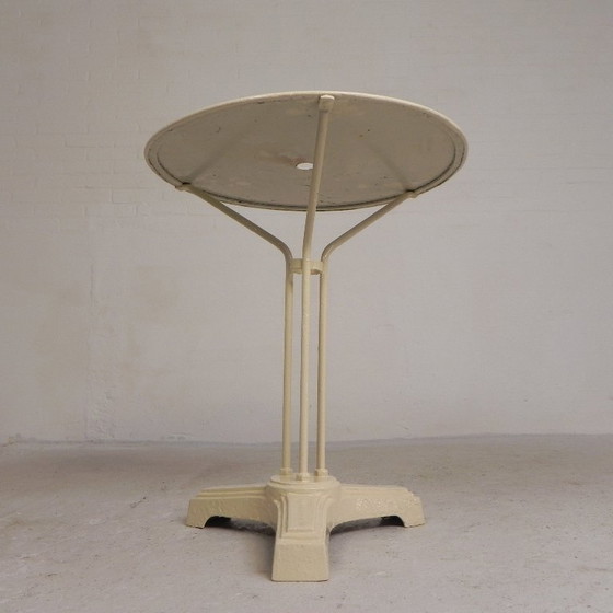 Bistro table with cast iron legs and round steel top, 1930s – Dining tables (photo 4 of 22)