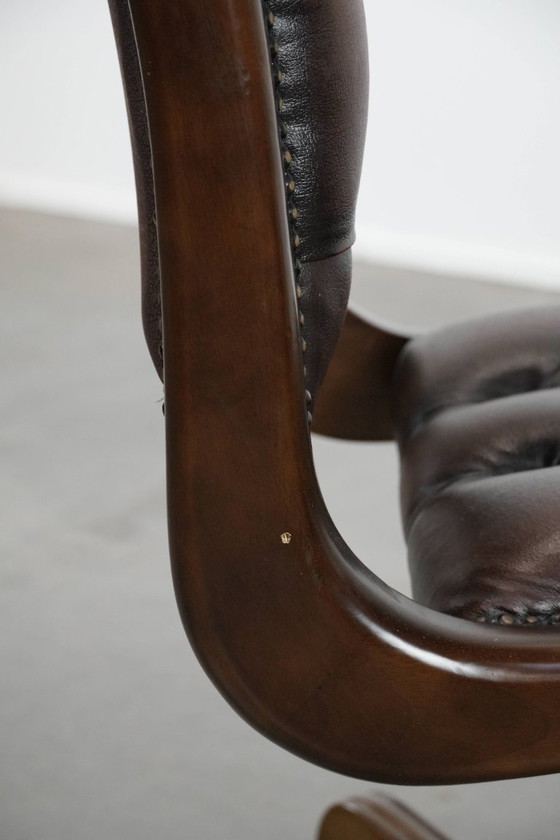 Image 1 of English-style Chesterfield office chair made of cowhide and wood on wheels
