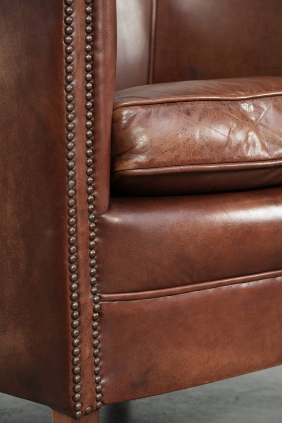 Image 1 of Rundleren clubfauteuil in een mooie donkere cognac kleur in Engelse stijl