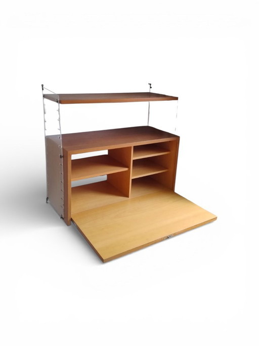 Nisse String wall system including sectary cupboard