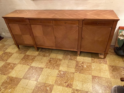 Elegante commode van massief mahoniehout met 4 deuren en 4 lades in de Directoire-stijl.