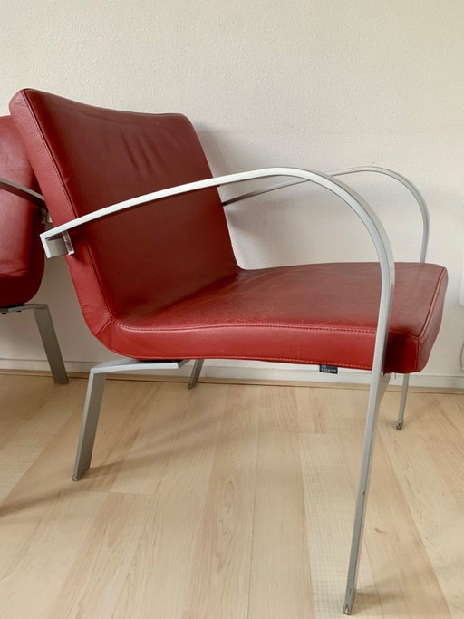 2 red leather Leolux Sentia armchairs
