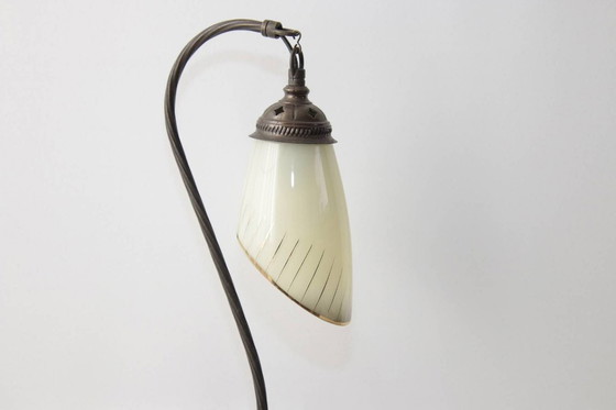 Image 1 of Vintage brass table lamp with curved arm and glass shade