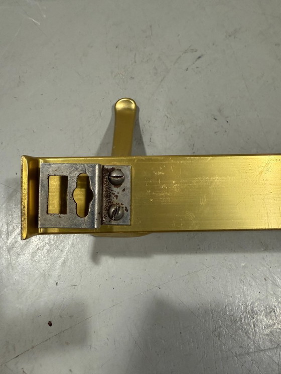 Image 1 of Goudkleurige aluminium wandkapstokken jaren 1960