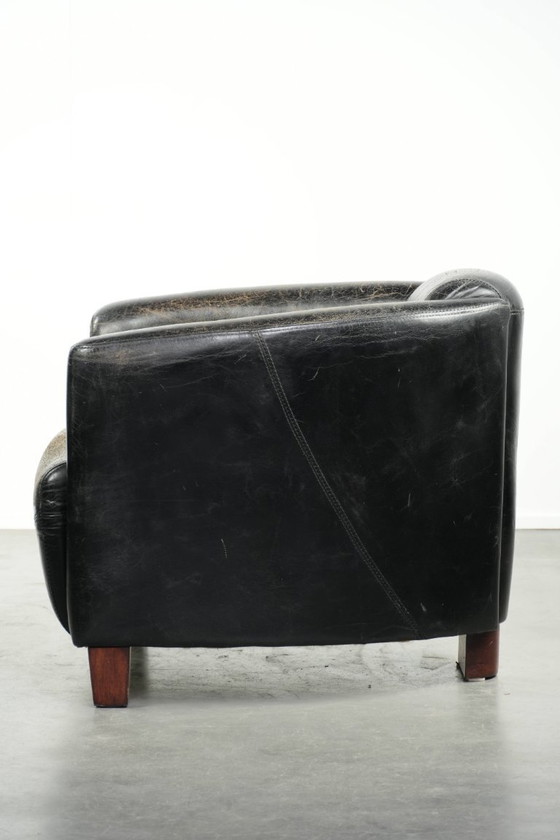 Image 1 of Zwarte vintage rundleren Aviator design fauteuil met een karaktervolle uitstraling