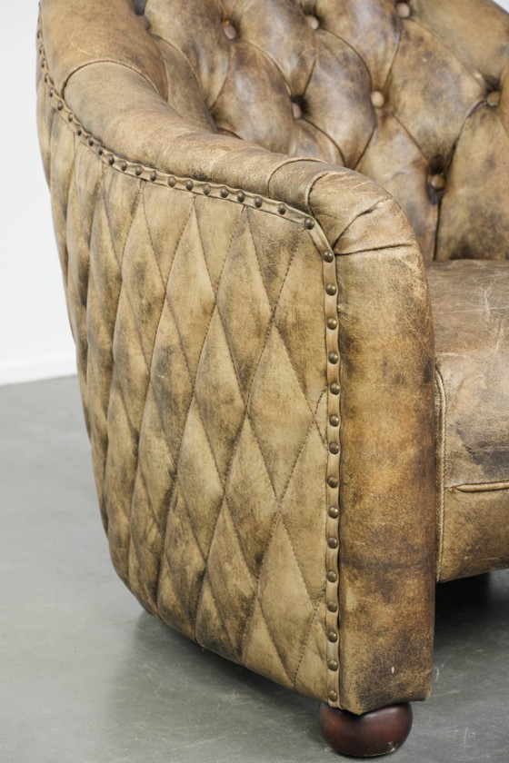 Image 1 of Einzigartiger, stilvoller und bequemer Chesterfield-Clubsessel aus Kuhfell mit einer wunderschönen Farbkombination.