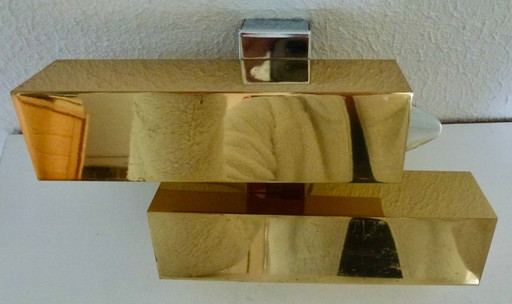 A brass wall lamp, in a minimalist, geometric style, from the middle of the last century.
