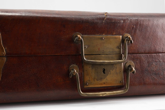 Image 1 of Vintage brown leather suitcase with copper details, China 1900s