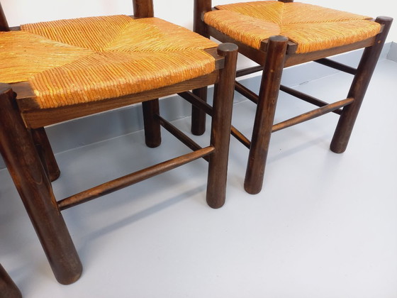 Image 1 of Set van 4 vintage brutalistische stoelen van Georges Robert, gemaakt van hout en stro, uit de jaren 50 en 60.