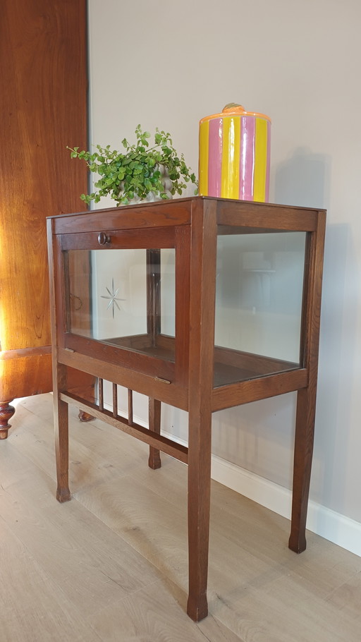 Sleek vintage tea cabinet with cut star