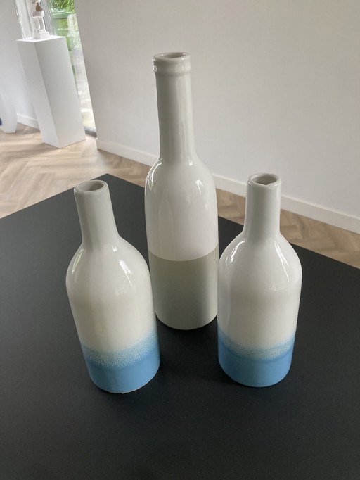 Set of three decorative bottles