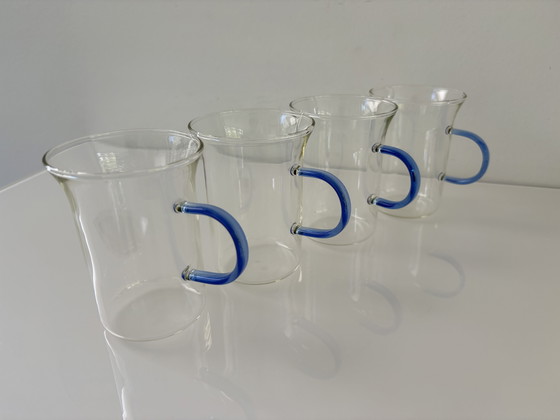 Image 1 of Set of four glass tea mugs with colored handles