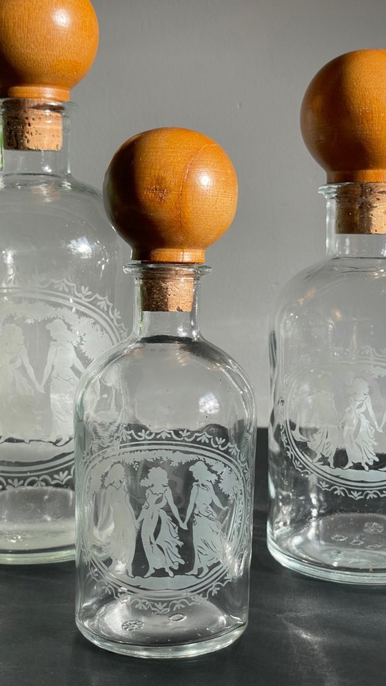 Image 1 of Vintage Engraved Glass and Wood Bottles