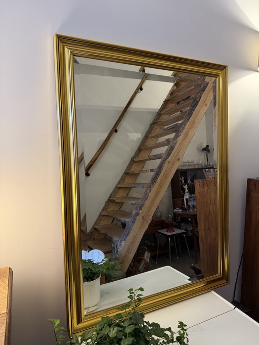 Grand miroir à facettes dans un cadre doré