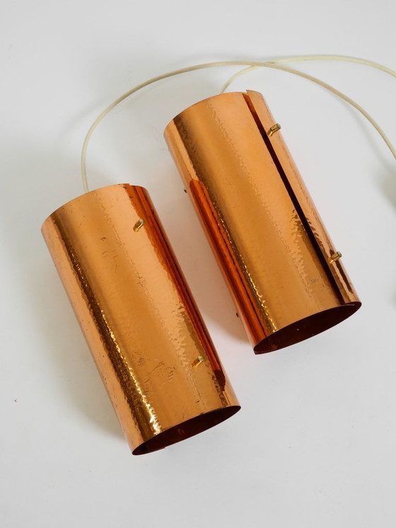 Image 1 of Two rare mid-century tube pendant lamps consisting of two screwed-together copper bowls