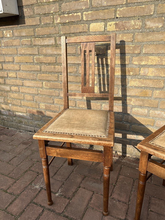 Image 1 of Dining room chairs with fabric seats and nail trim.